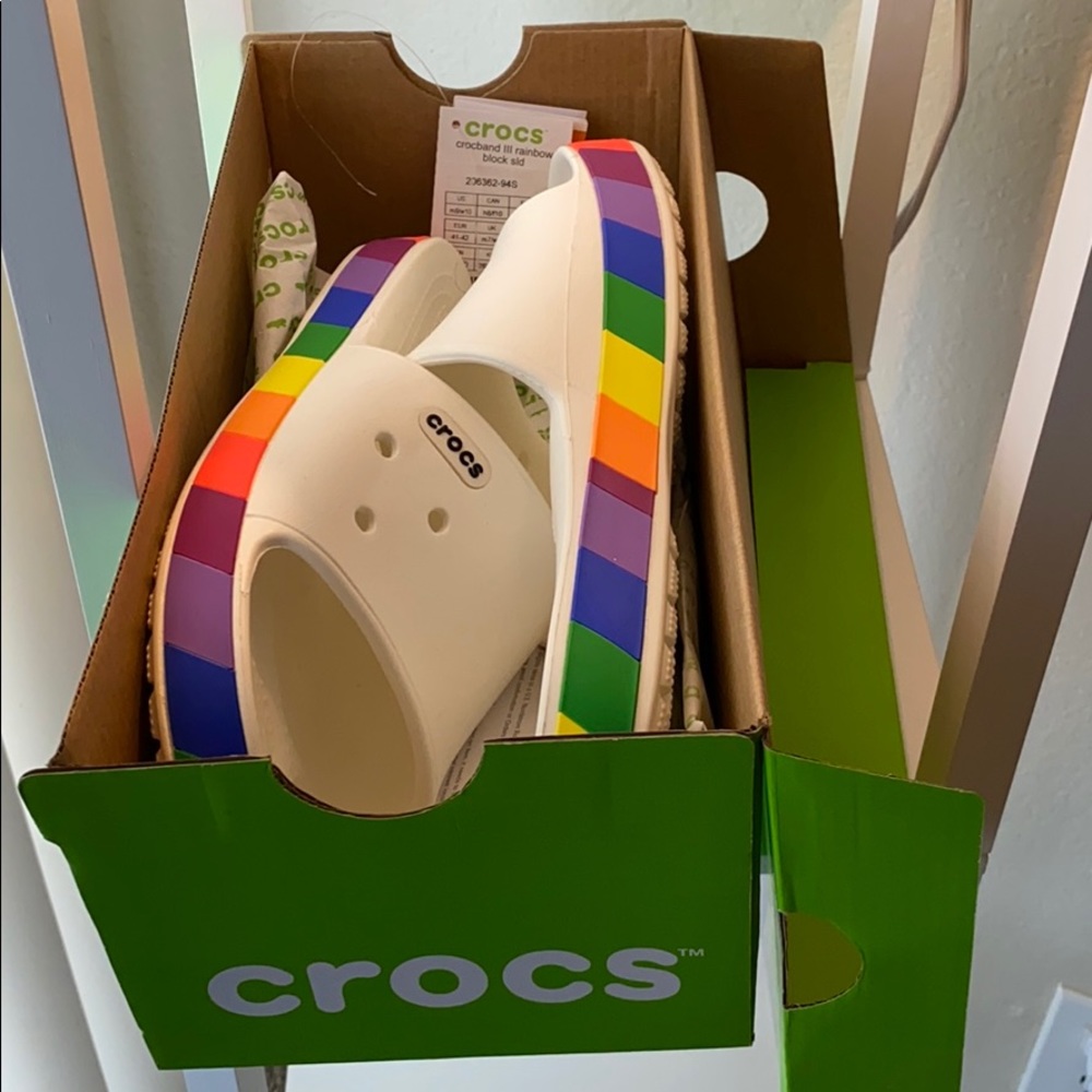 Woman’s limited edition Crocs rainbow block slides